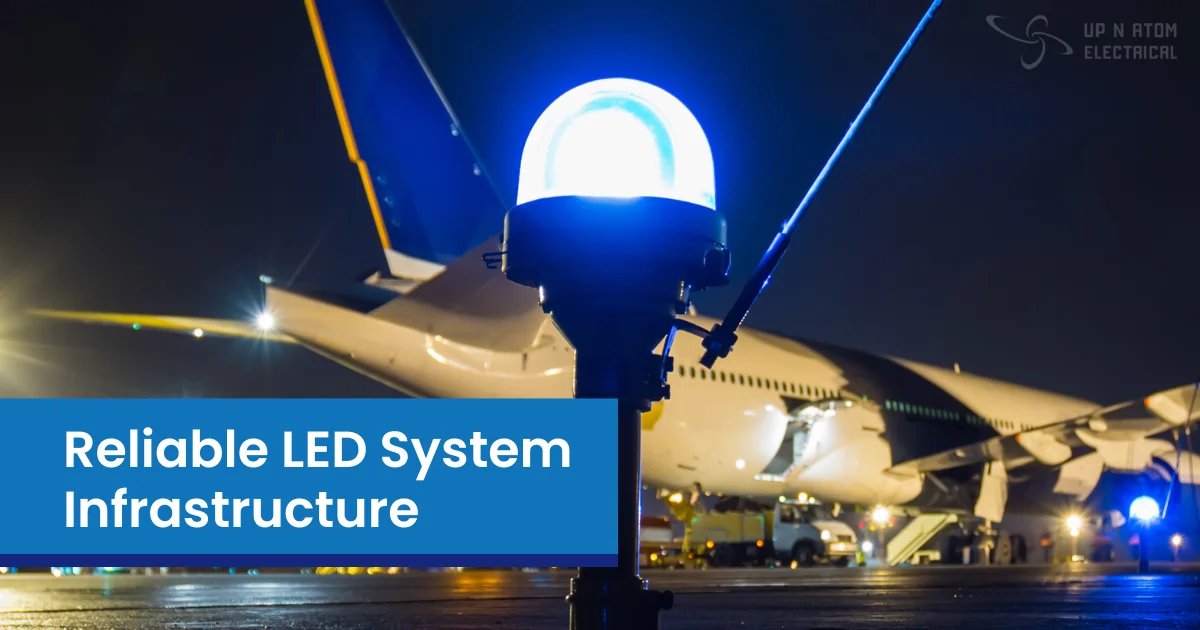 Bright blue LED light near airplane on airport tarmac at night